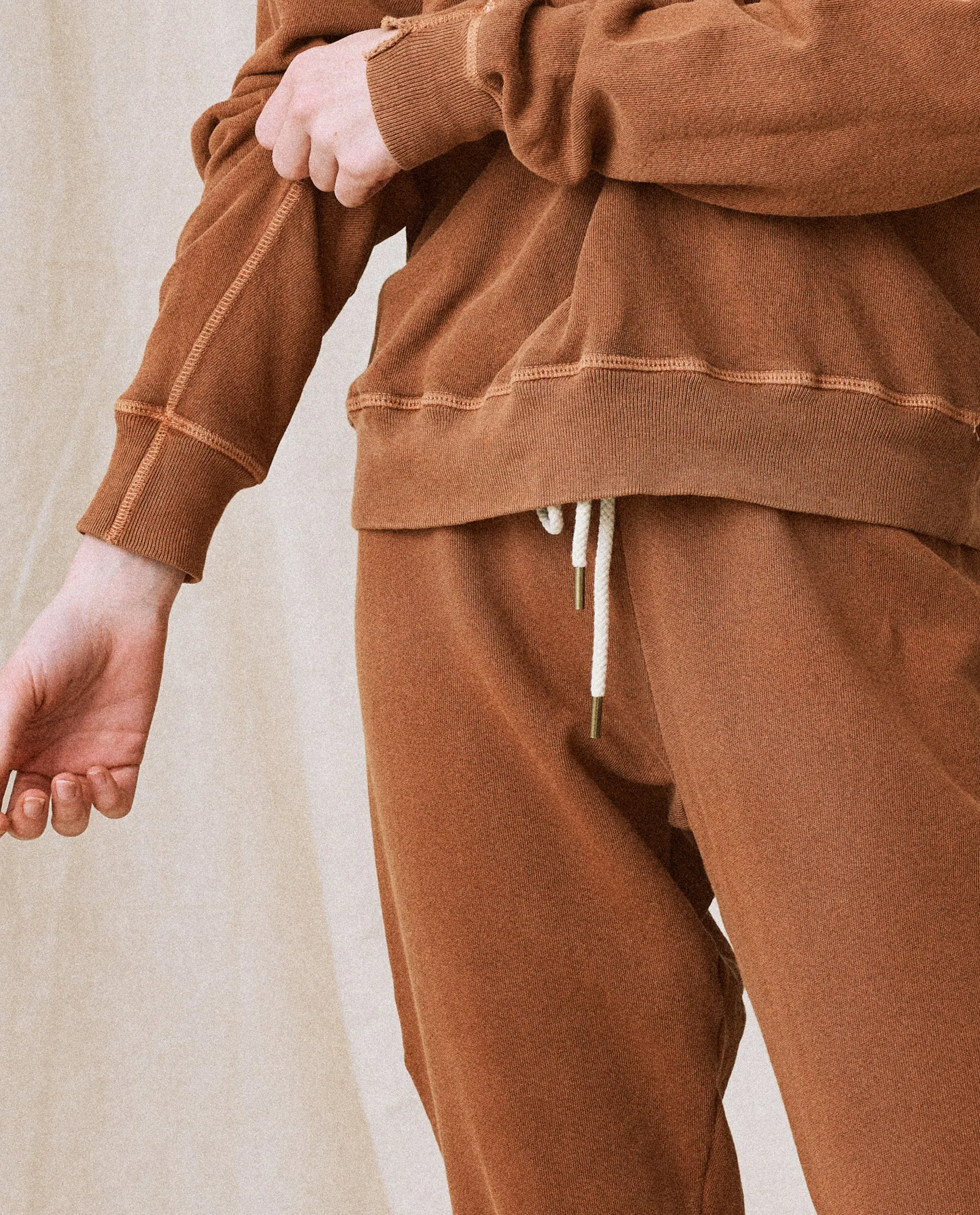 The Stadium Sweatpant. Solid -- Rust sold by THE GREAT.