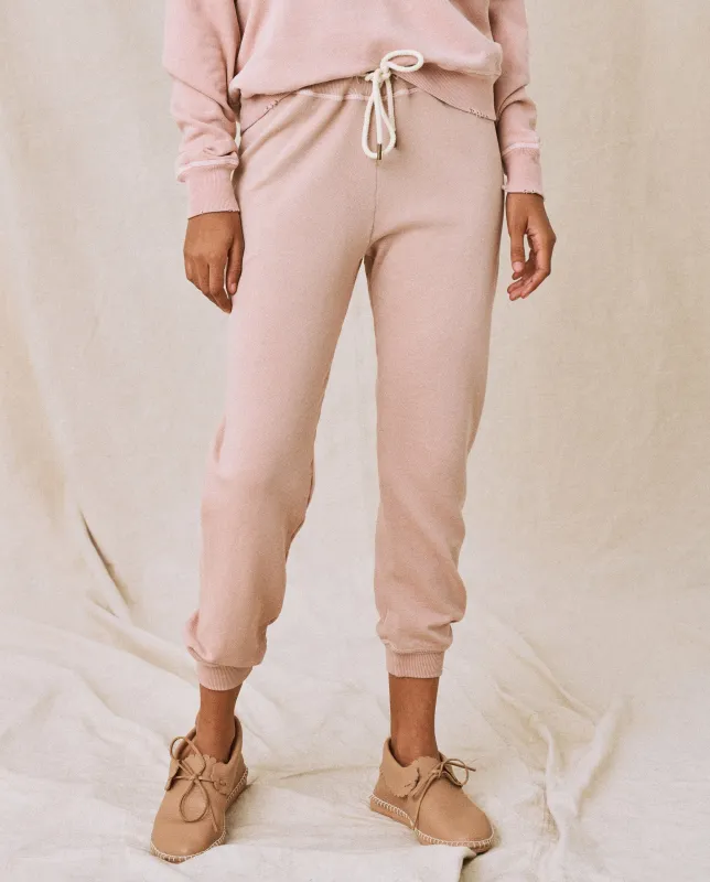 The Cropped Sweatpant. Solid -- Carnation sold by THE GREAT.