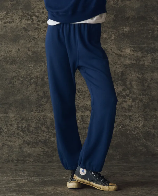 The Fleece Sport Sweatpant. Solid -- Navy sold by THE GREAT.