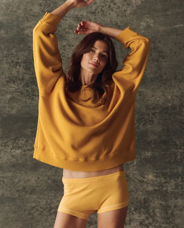 The Fleece Slouch Sweatshirt. Solid -- Bright Yellow sold by THE GREAT.
