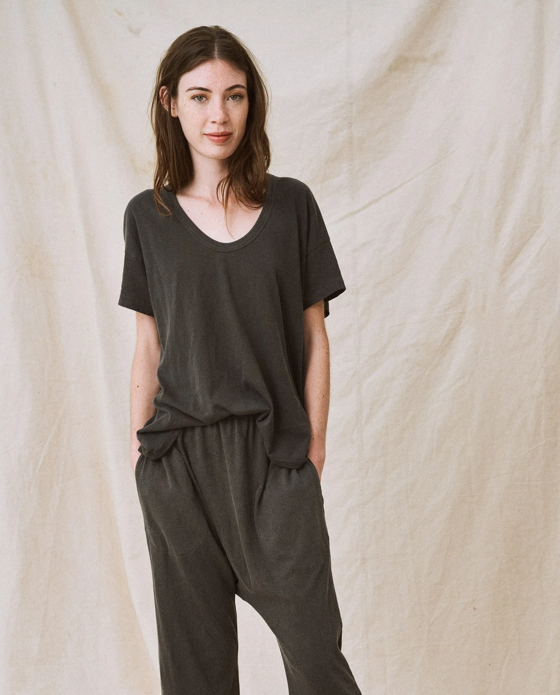 The U-Neck Tee. Solid -- Washed Black sold by THE GREAT.