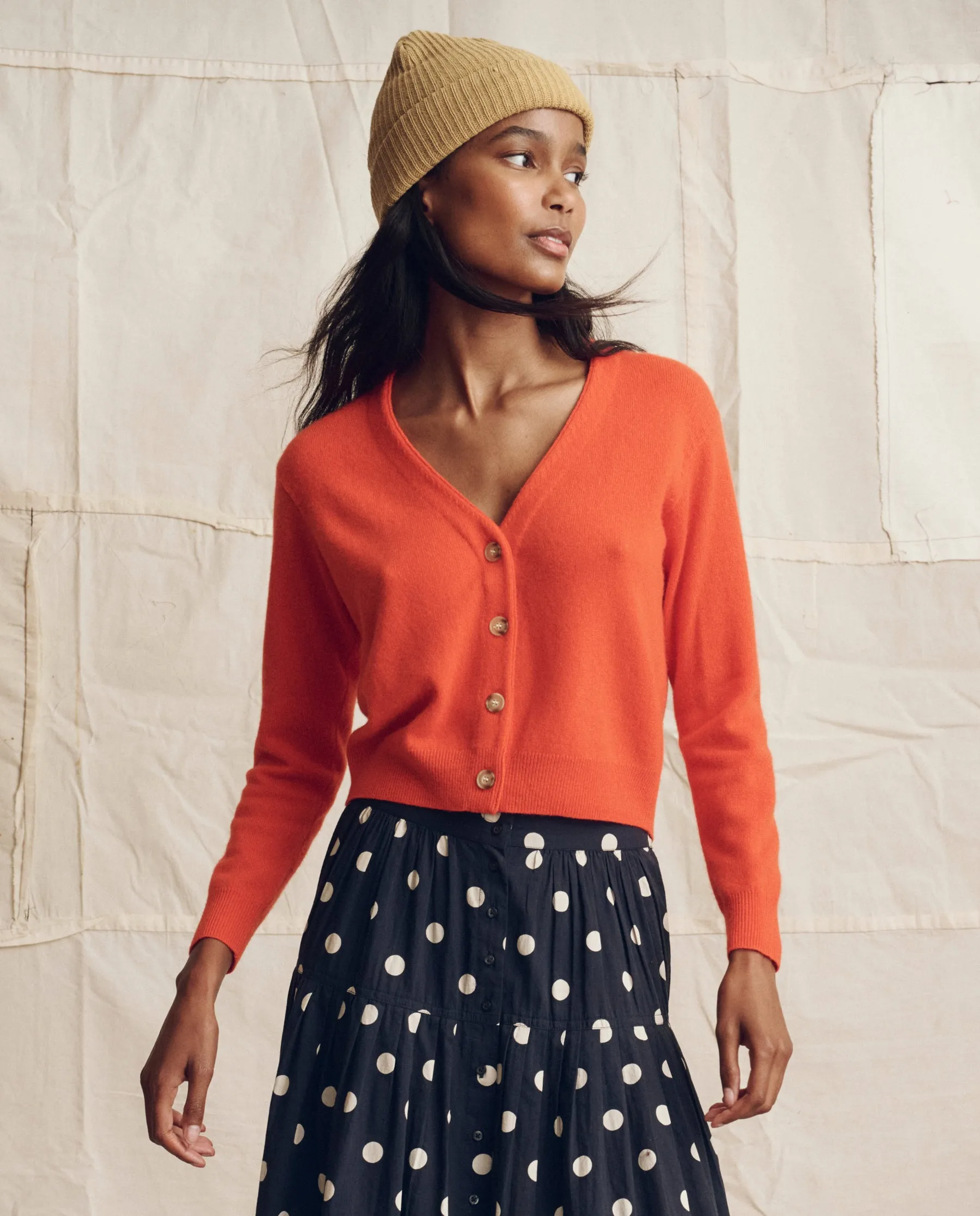 The Cashmere Tiny V Neck Cardigan. -- Hot Orange sold by THE GREAT.