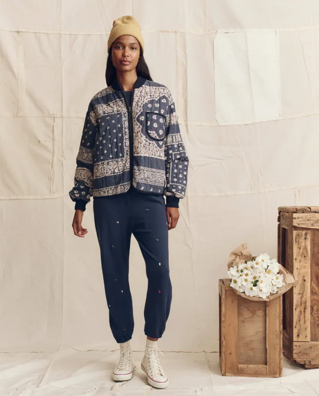 The Quilted Bomber. -- Navy Bandana Print sold by THE GREAT.