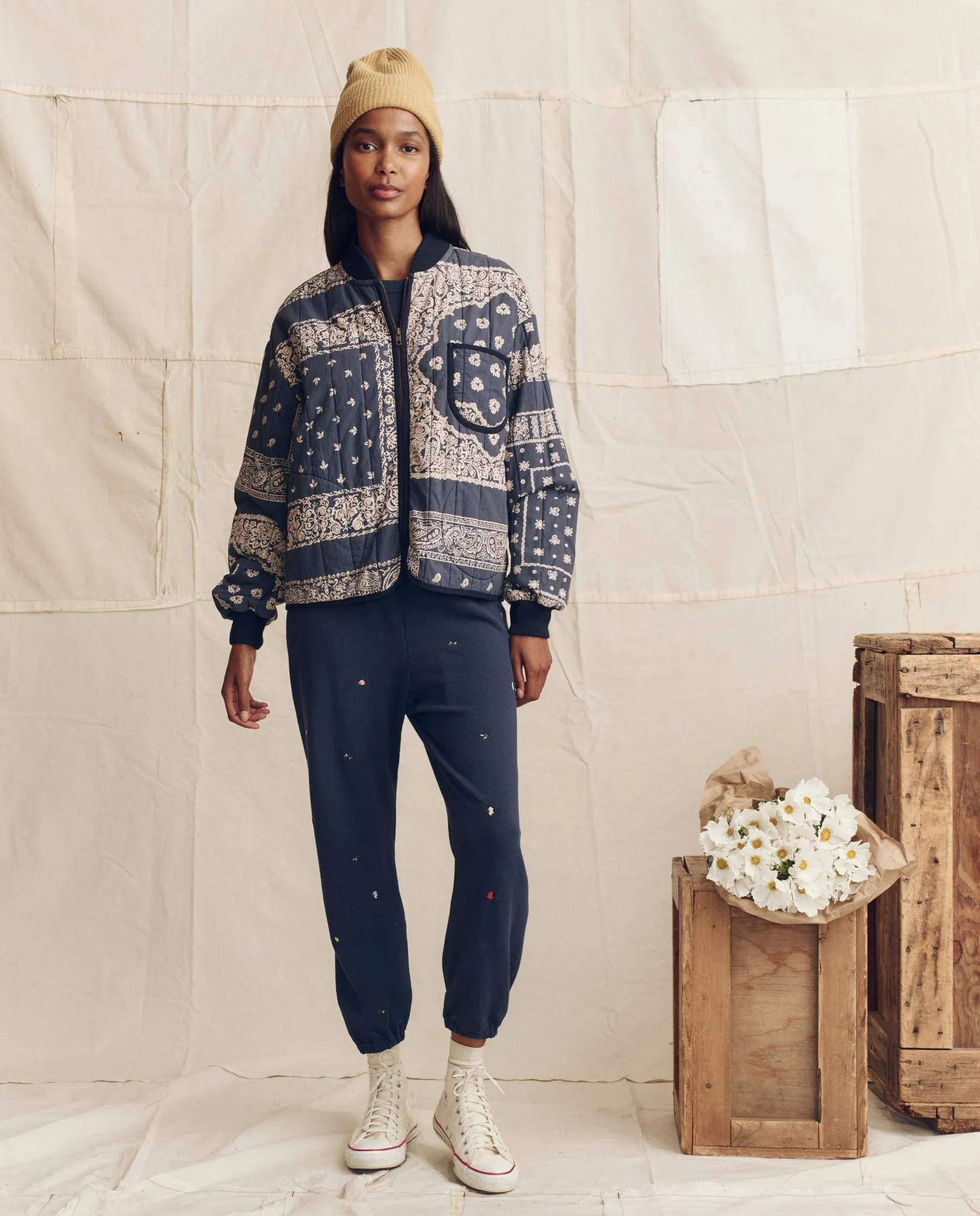 The Quilted Bomber. -- Navy Bandana Print sold by THE GREAT.