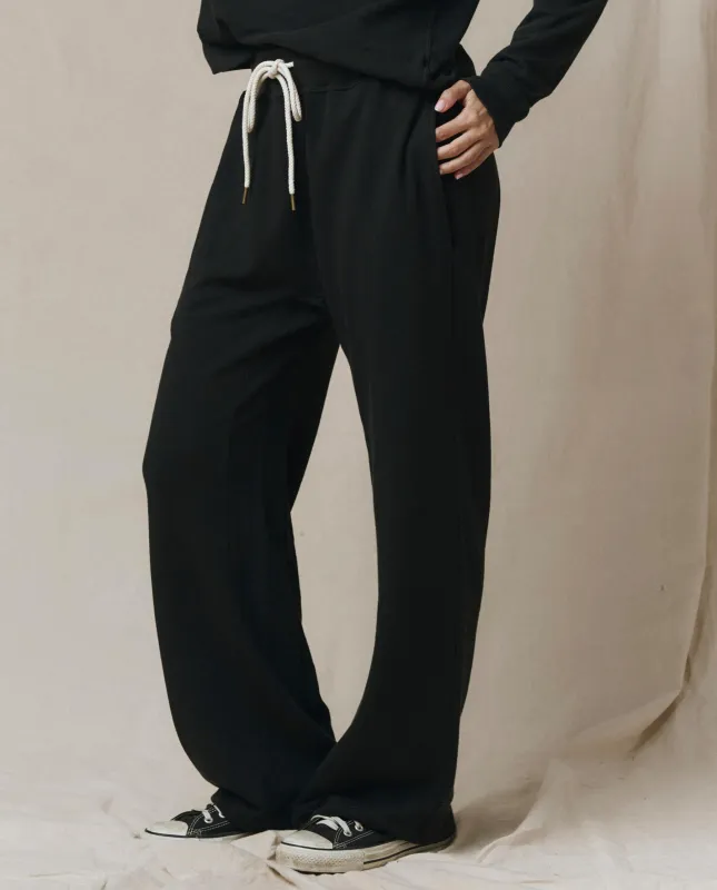 The Horseshoe Sweatpant. Solid -- Almost Black sold by THE GREAT.