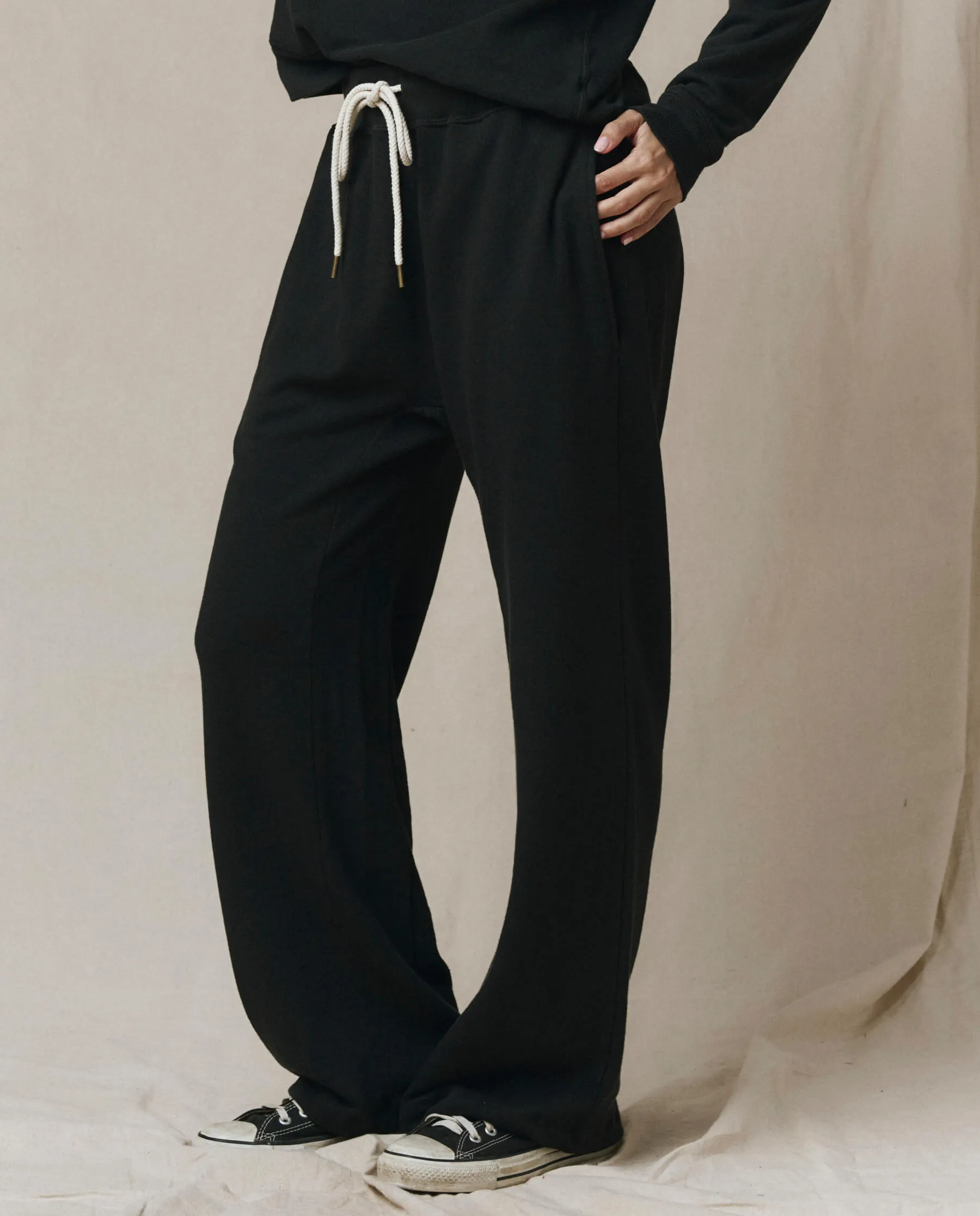 The Horseshoe Sweatpant. Solid -- Almost Black sold by THE GREAT.