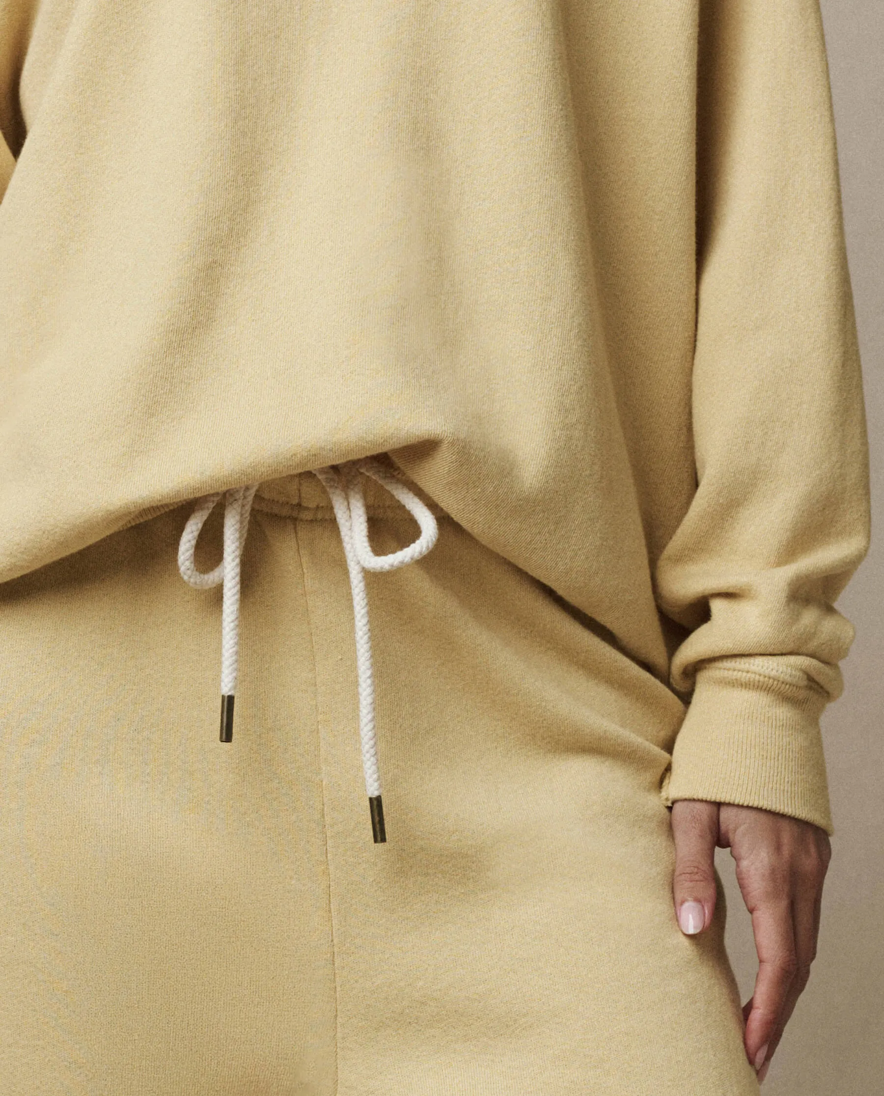 The Stadium Sweatpant. Solid -- Butter Yellow sold by THE GREAT.