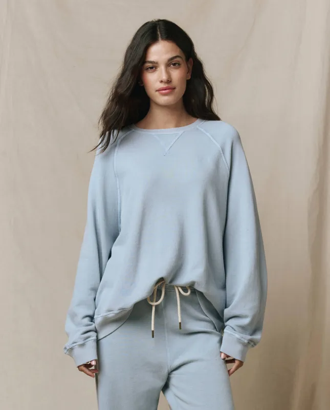 The Slouch Sweatshirt. Solid -- Whisper Blue sold by THE GREAT.