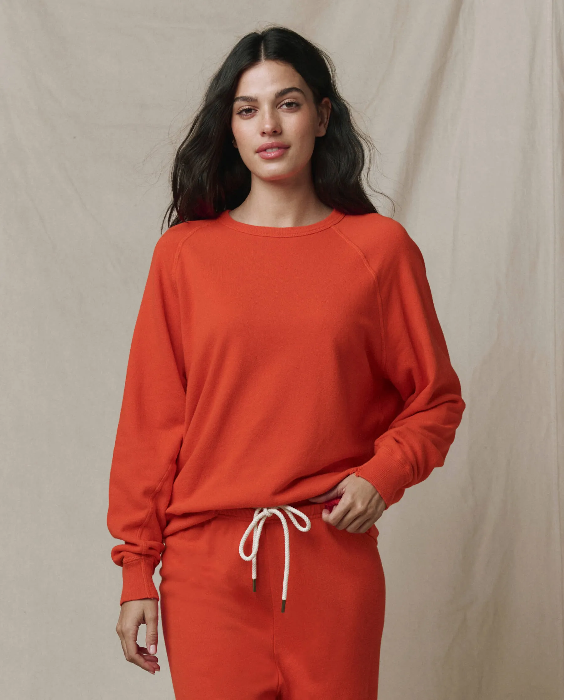 The College Sweatshirt. Solid -- Persimmon sold by THE GREAT.