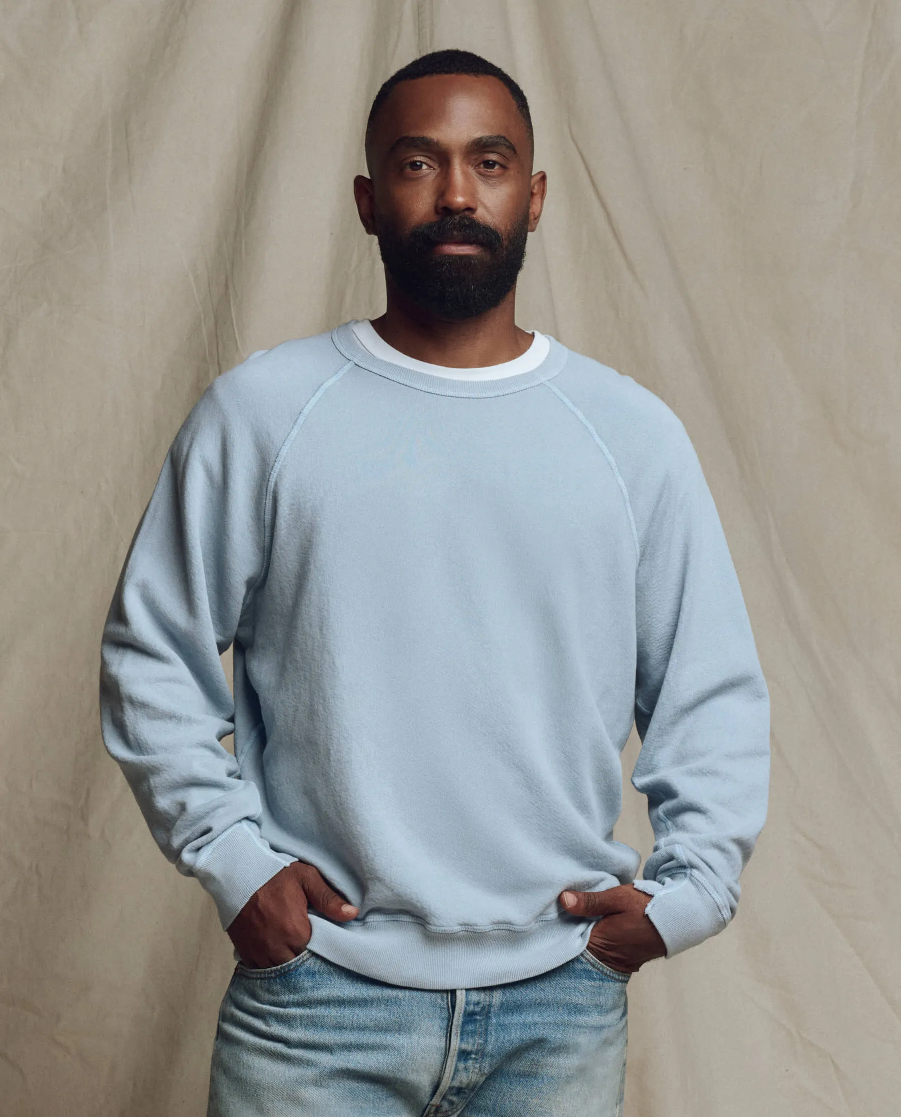 The Men's College Sweatshirt. Solid -- Whisper Blue sold by THE GREAT.