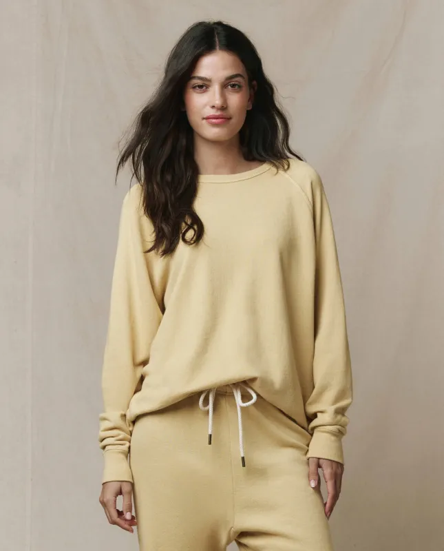 The Slouch Sweatshirt. Solid -- Butter Yellow sold by THE GREAT.