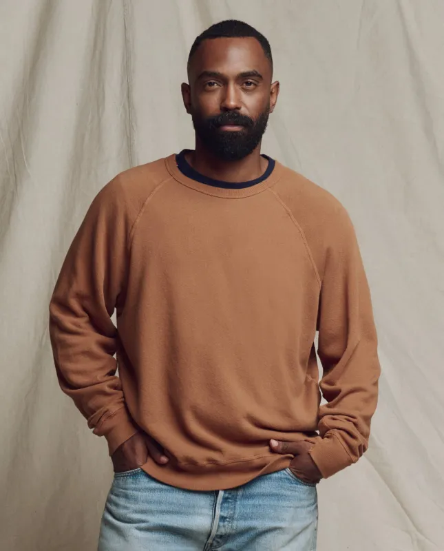 The Men's College Sweatshirt. Solid -- Rust sold by THE GREAT.