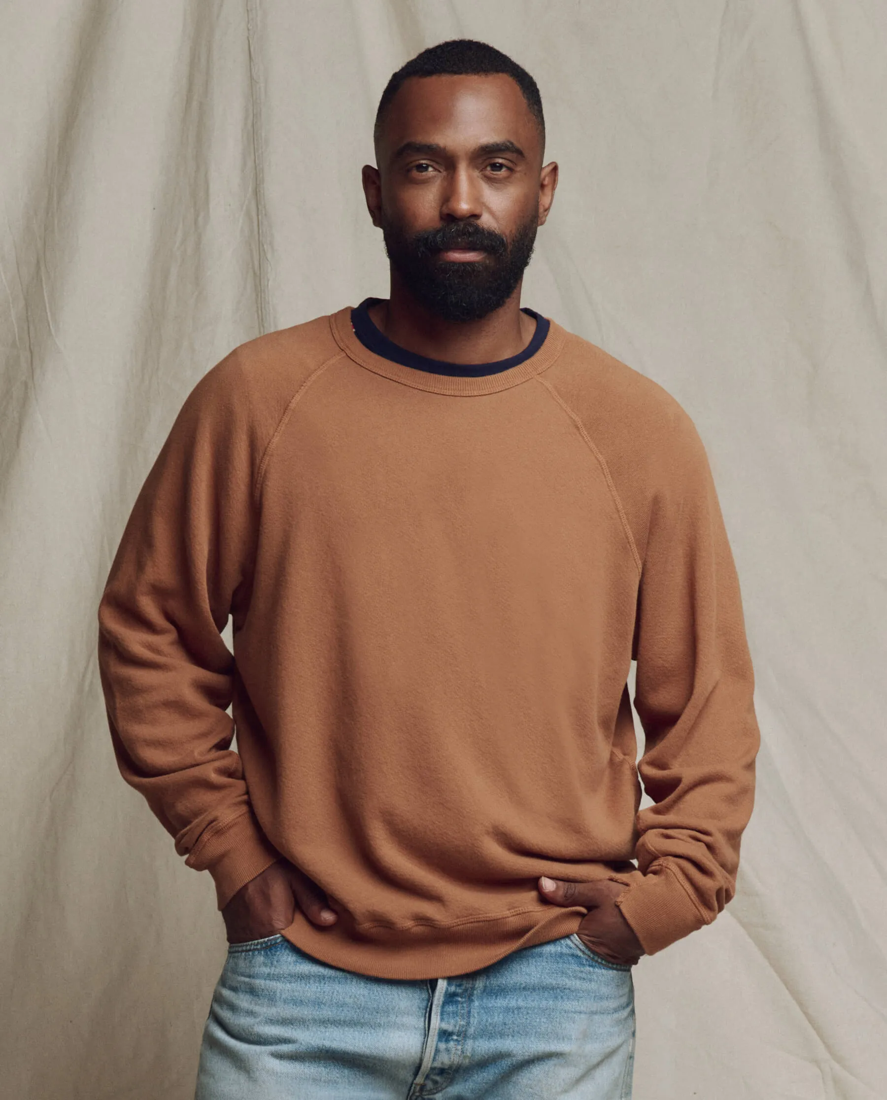 The Men's College Sweatshirt. Solid -- Rust sold by THE GREAT.