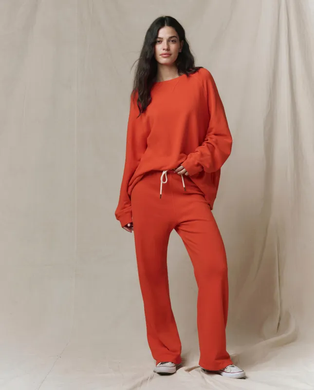 The Lap Sweatpant. Solid -- Persimmon sold by THE GREAT.