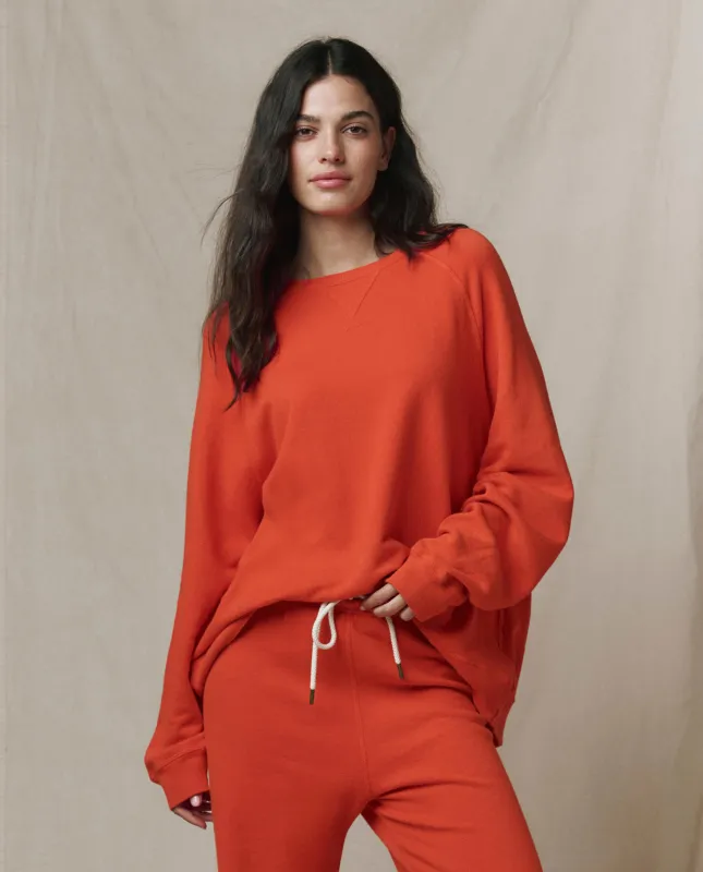 The Slouch Sweatshirt. Solid -- Persimmon sold by THE GREAT.