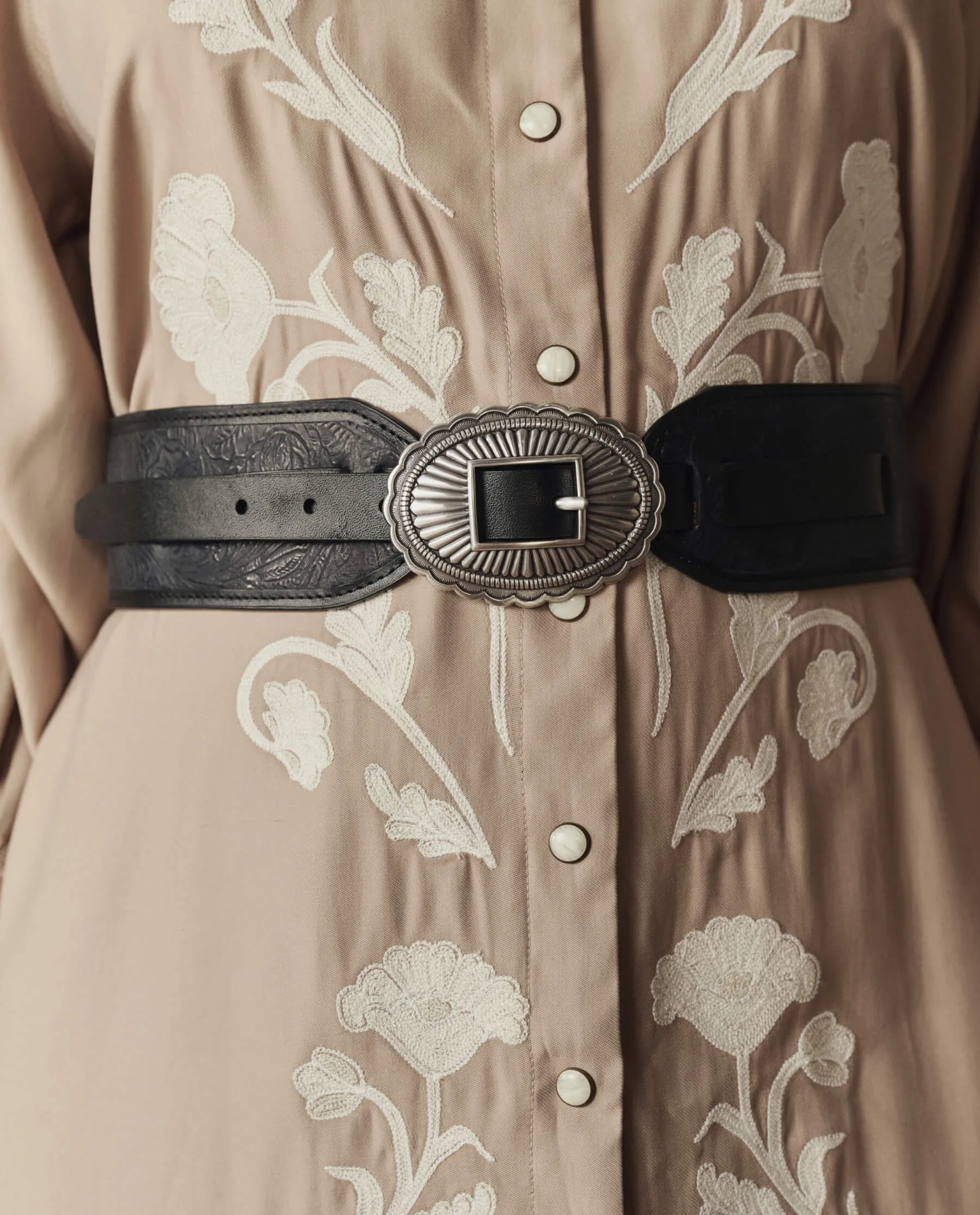 The Tooled Waist Belt. -- Black With Silver sold by THE GREAT.