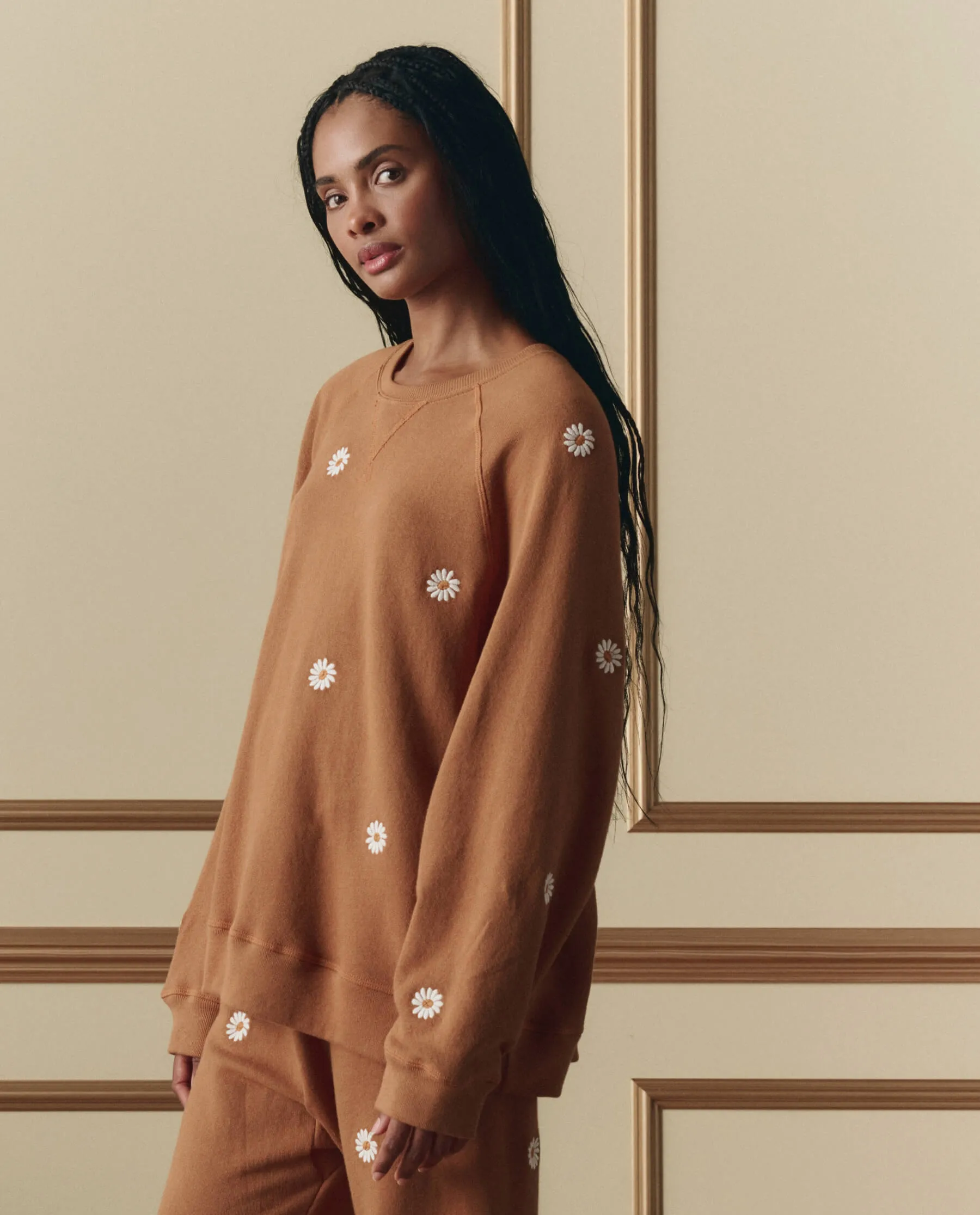 The Slouch Sweatshirt W/ Floating Daisy Embroidery. -- Suntan sold by THE GREAT.