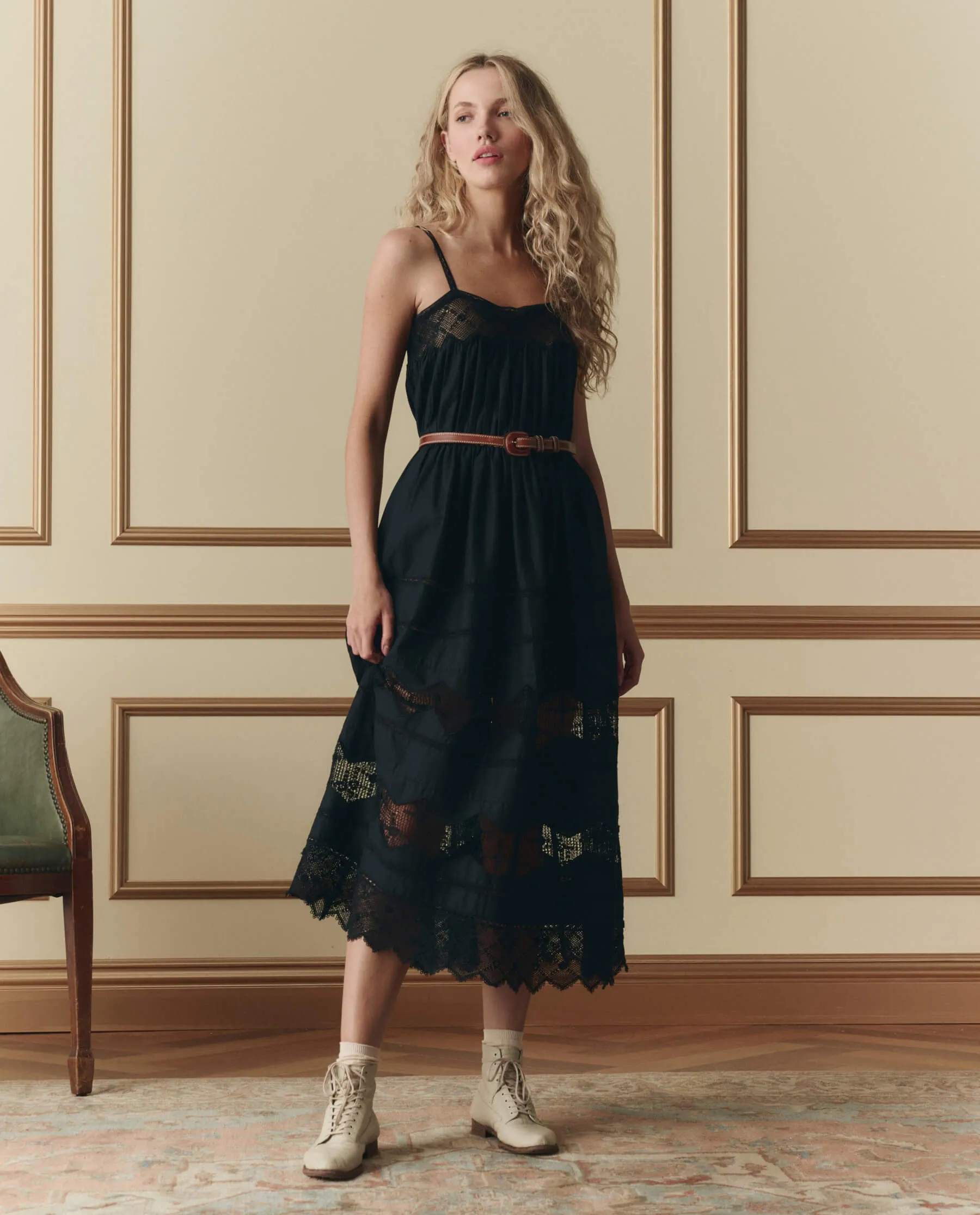 The Rosette Crochet Dress. -- Black sold by THE GREAT.