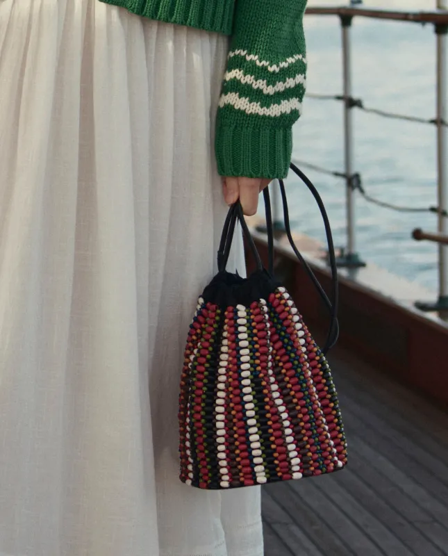 The Beaded Cinched Bucket Bag. -- Cabana Stripe made by THE GREAT.