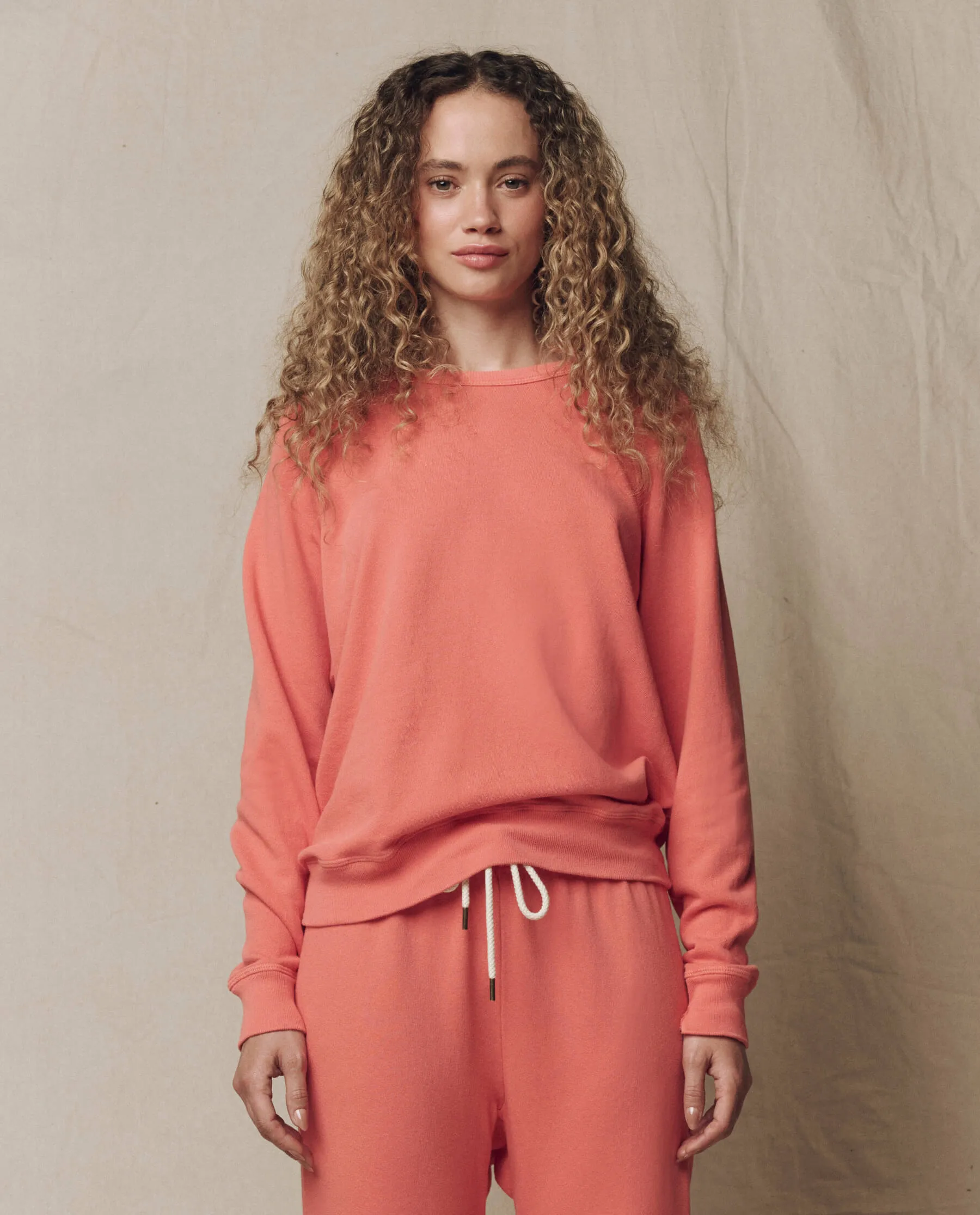The College Sweatshirt. Solid -- Guava sold by THE GREAT.