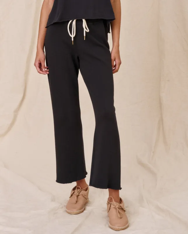 The Wide Leg Cropped Sweatpant. -- Almost Black sold by THE GREAT.