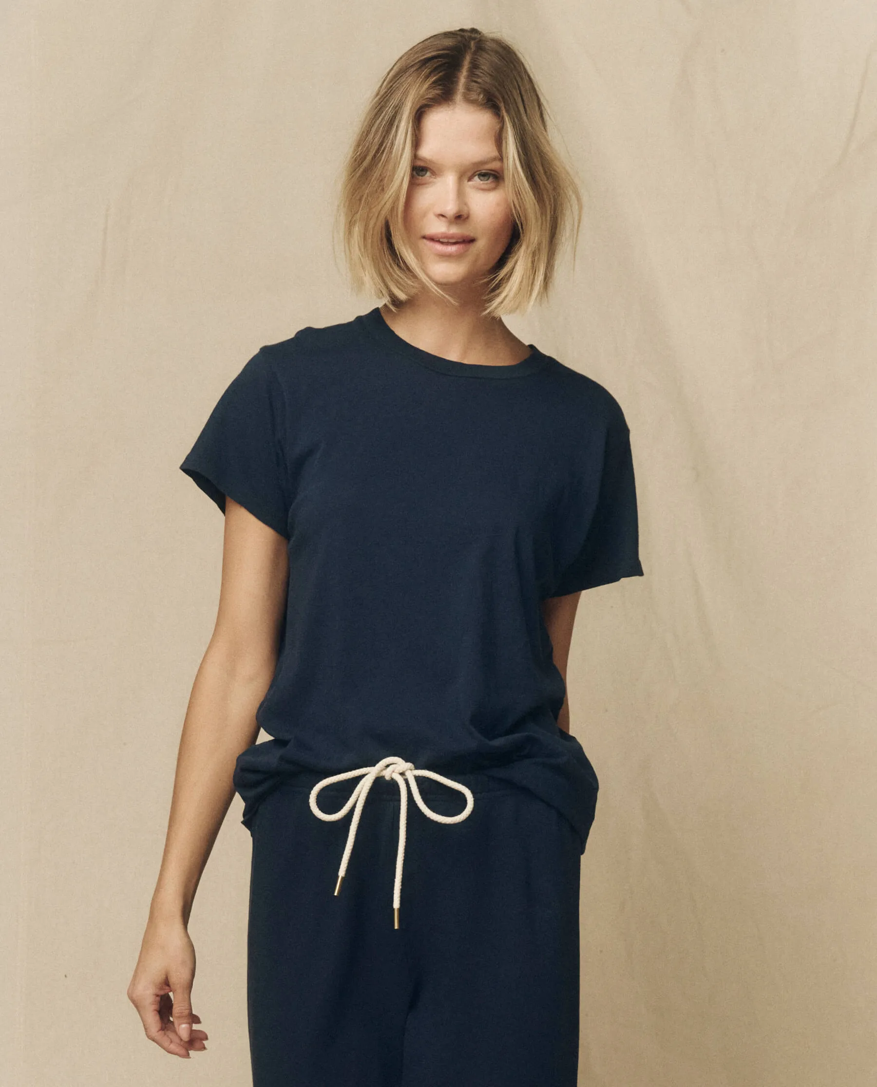 The Slim Tee. Solid -- True Navy sold by THE GREAT.