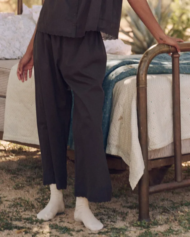 The Eyelet Easy Sleep Pant. -- Black sold by THE GREAT.