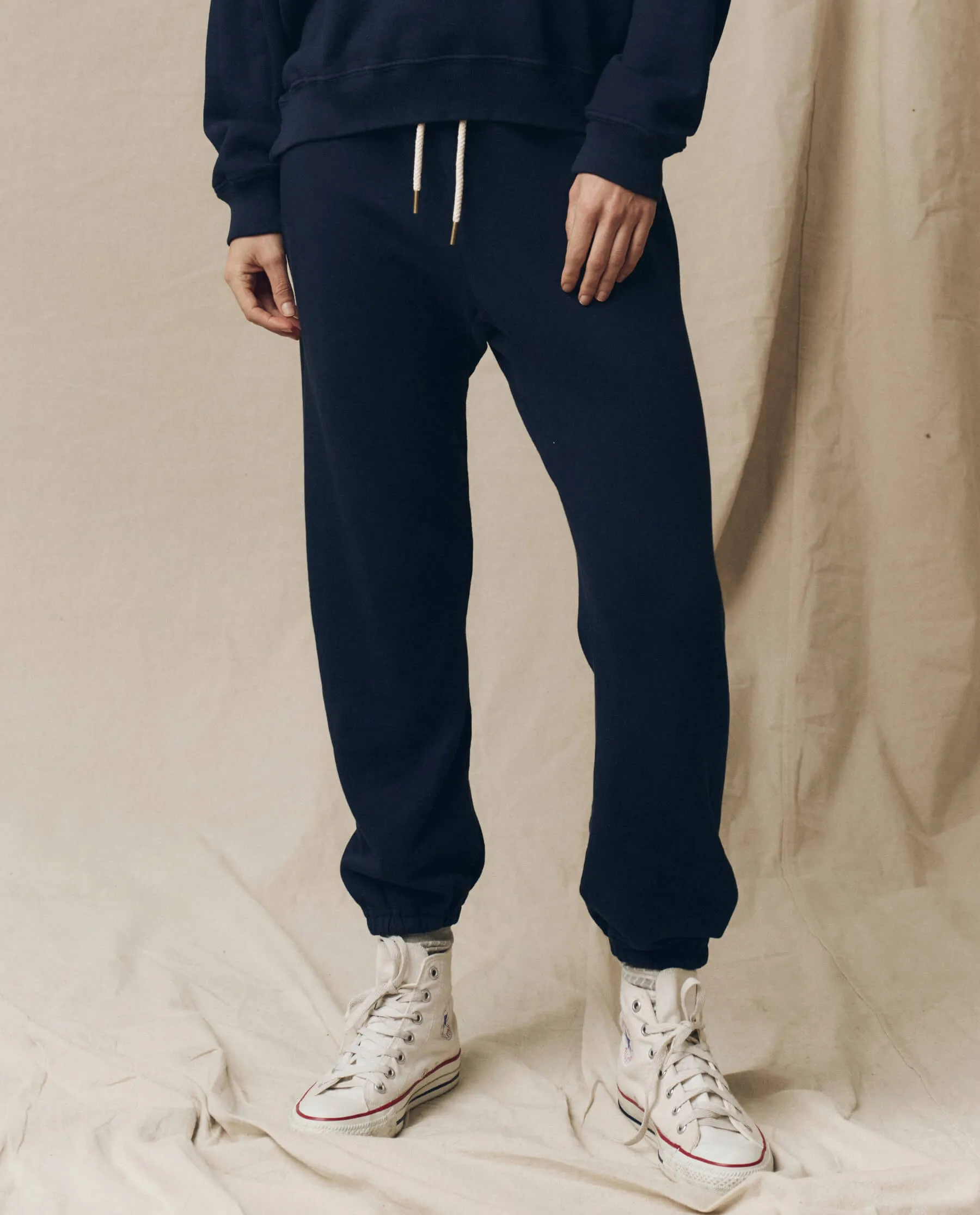 The Stadium Sweatpant. Solid -- True Navy sold by THE GREAT.