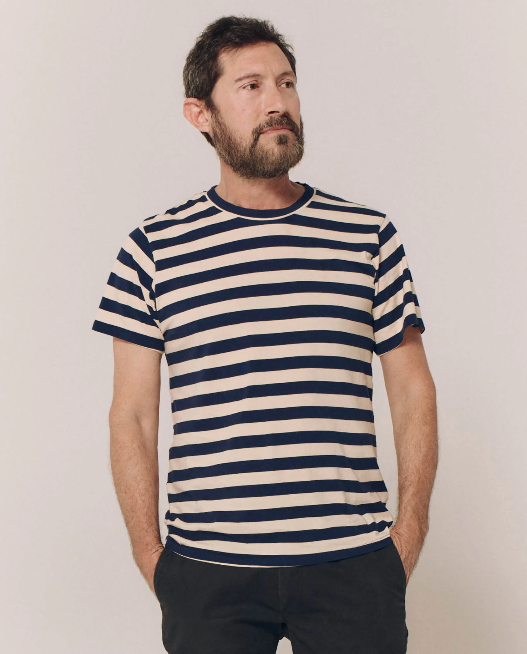 The Men's Slim Tee. -- Navy and Cream Scholar Stripe sold by THE GREAT.