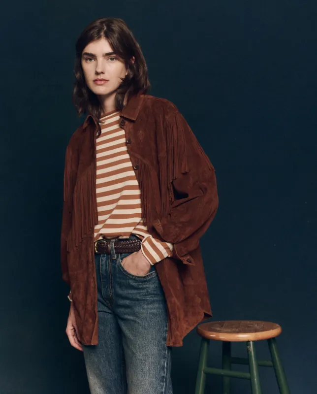 The Suede Fringe Shirt Jacket. -- Cognac sold by THE GREAT.