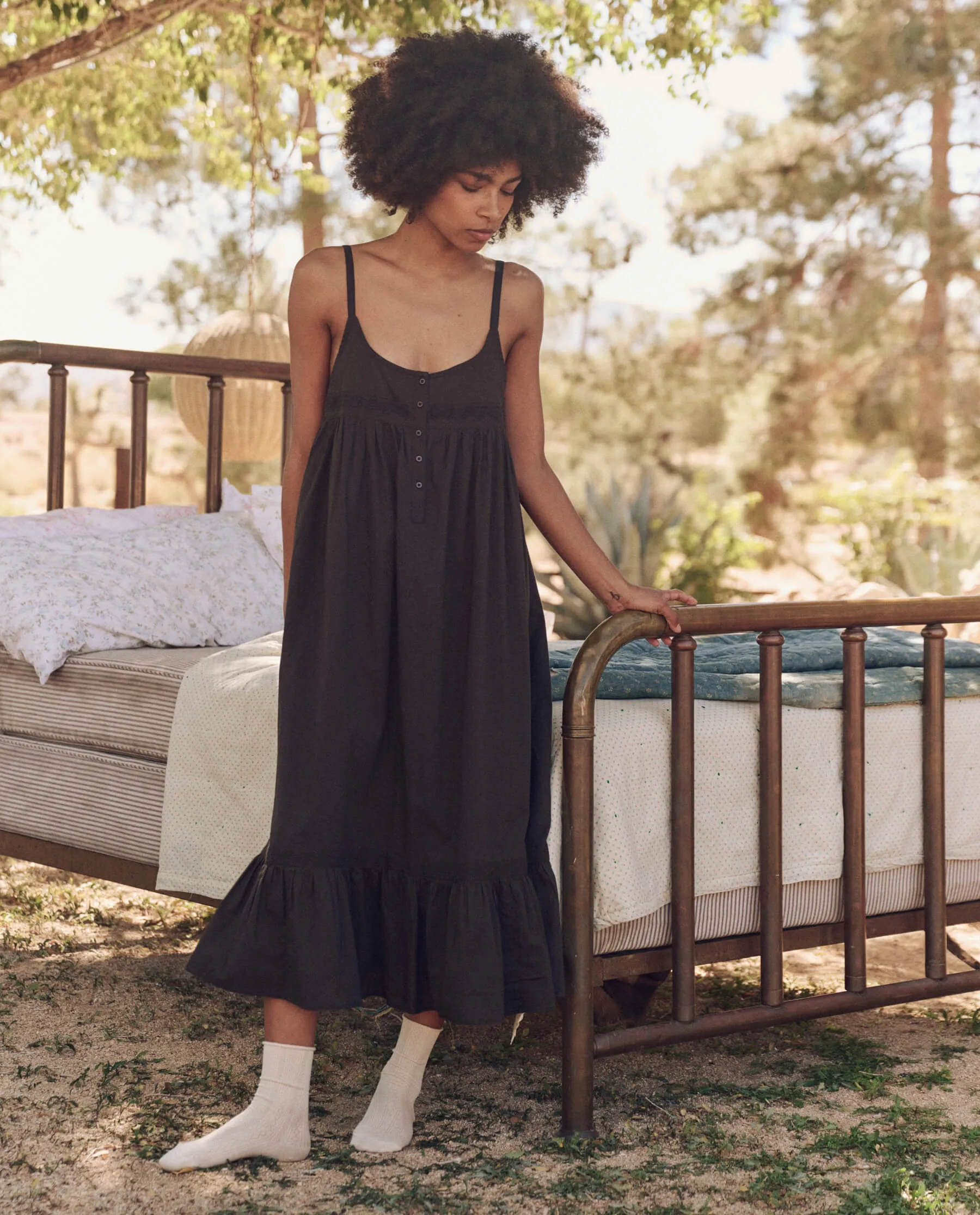 The Eyelet Ruffle Tank Night Dress. -- Black sold by THE GREAT.
