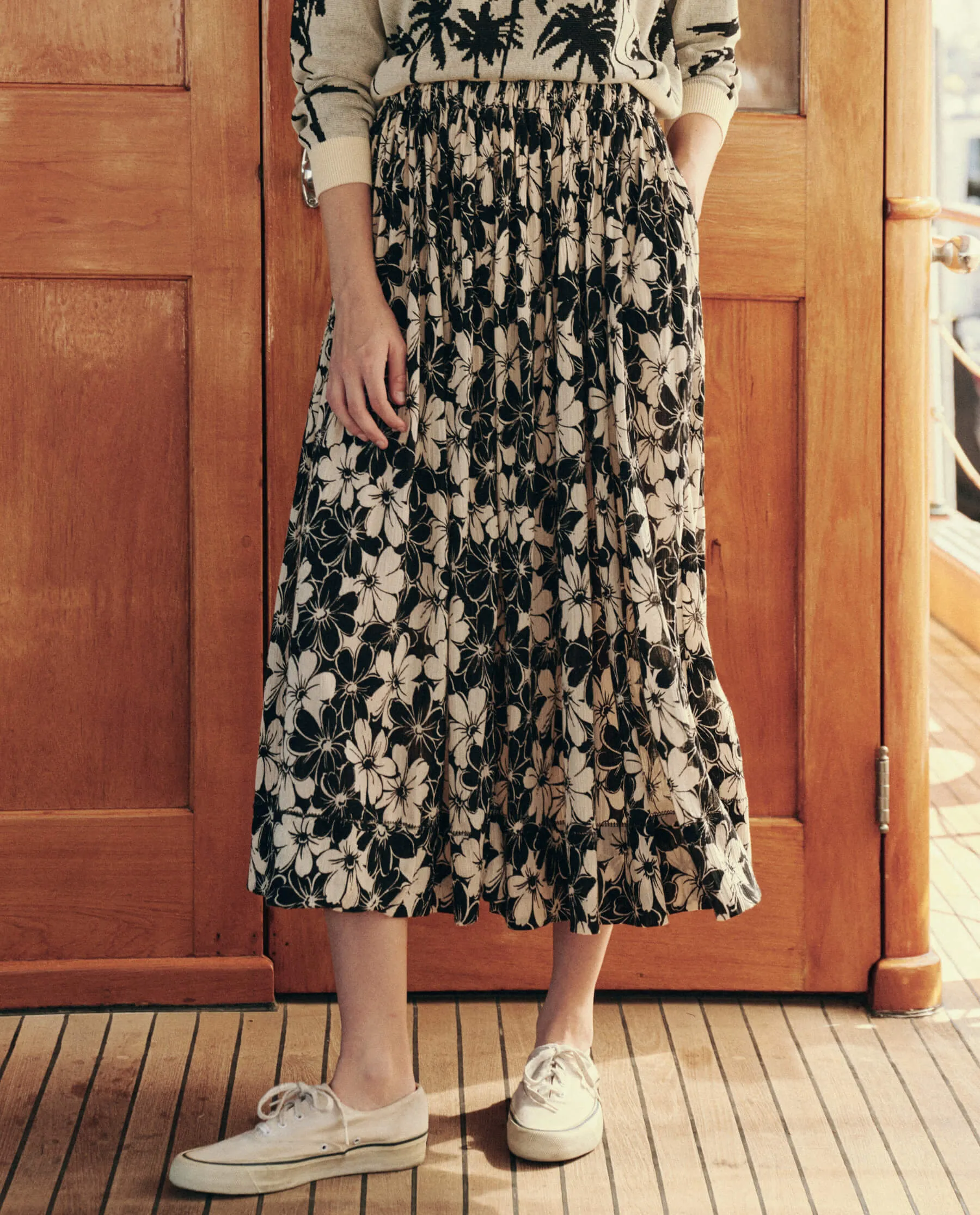 The Sway Skirt. -- Black and Cream Hibiscus Floral sold by THE GREAT.