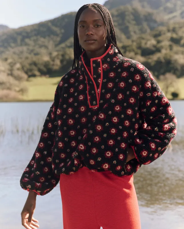 The Countryside Pullover. -- Navy Geo Daisy sold by THE GREAT.