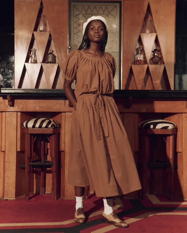 The Hills Top. -- Suntan sold by THE GREAT.