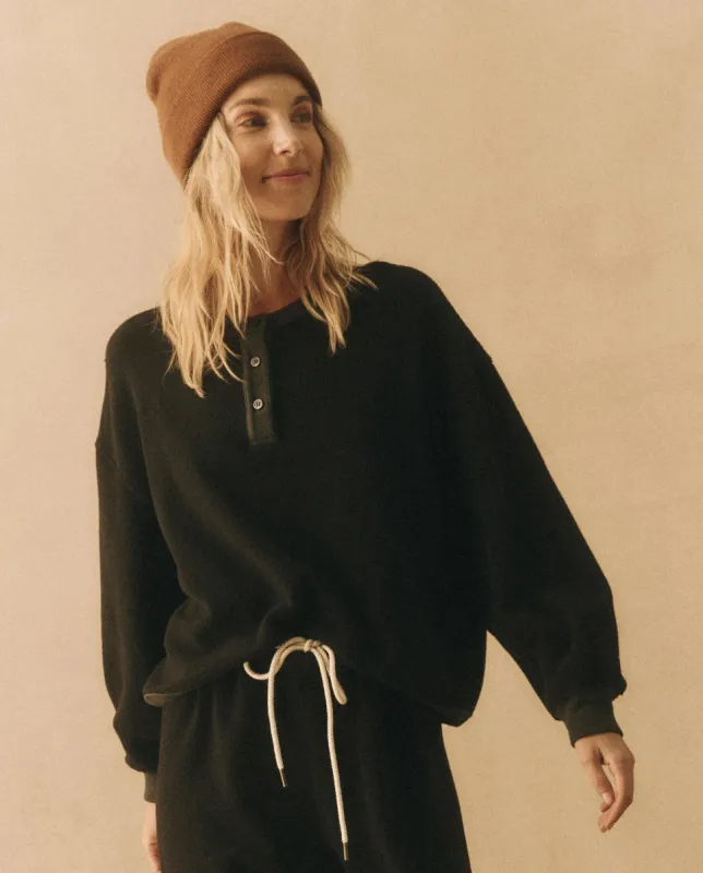 The Fleece Henley Sweatshirt. -- Almost Black made by THE GREAT.