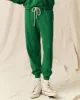 The Cropped Sweatpant. Solid -- Holly Leaf sold by THE GREAT.