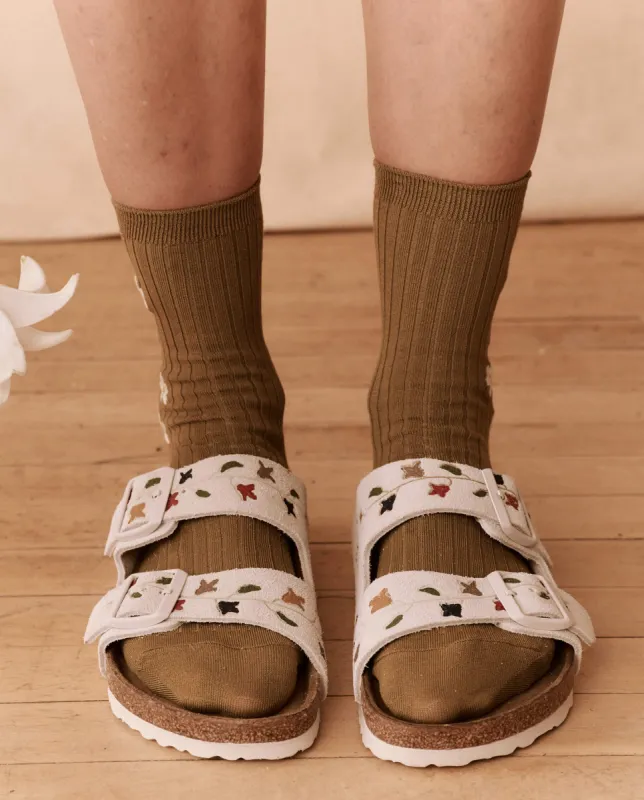 The BIRKENSTOCK Arizona with Hand Painted Tooled Tulip. -- Antique White with Multi sold by THE GREAT.
