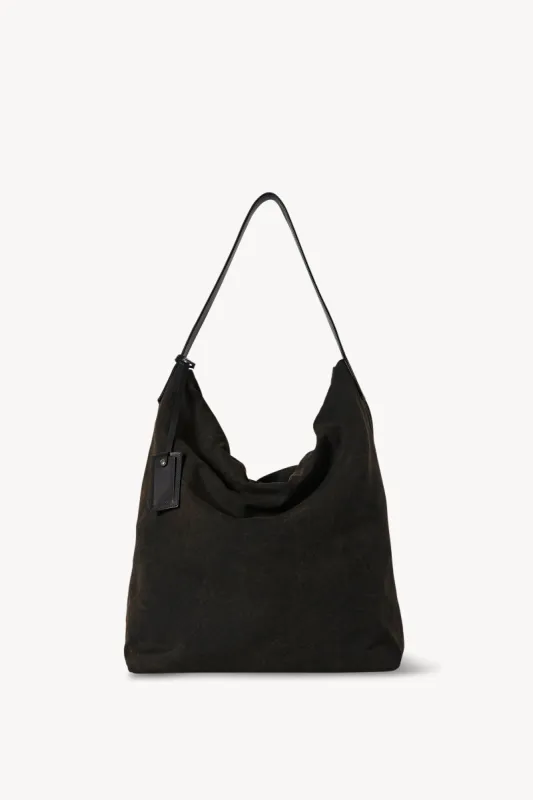 TR611 N/S Sling Bag in Denim sold by The Row