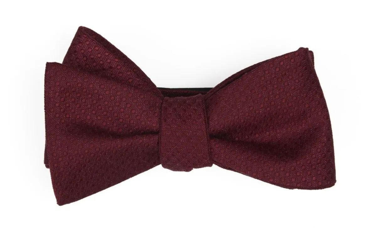 Dotted Spin Burgundy Bow Tie sold by The Tie Bar