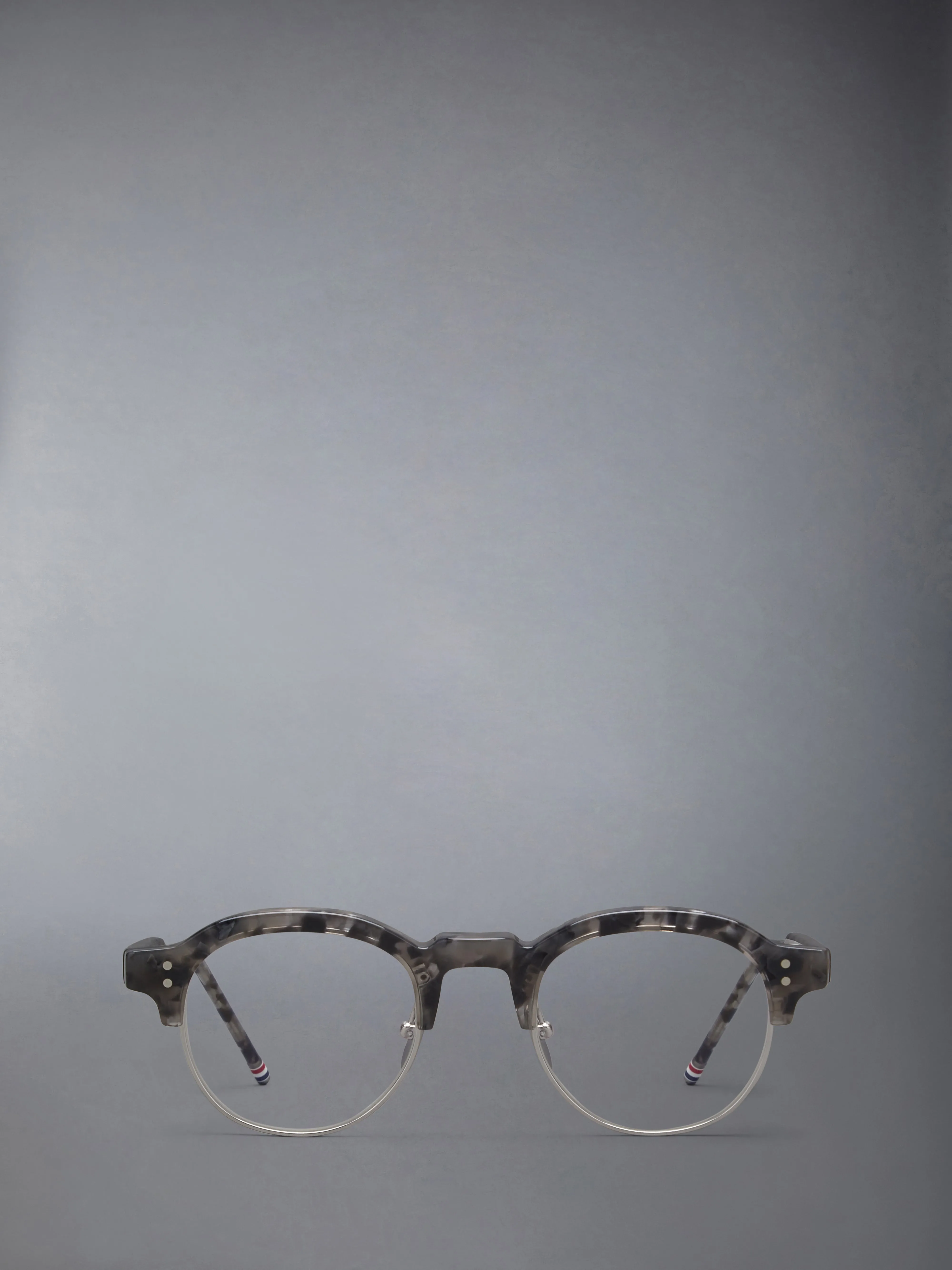 TORTOISE ACETATE AND TITANIUM OVAL EYEGLASSES sold by Thom Browne