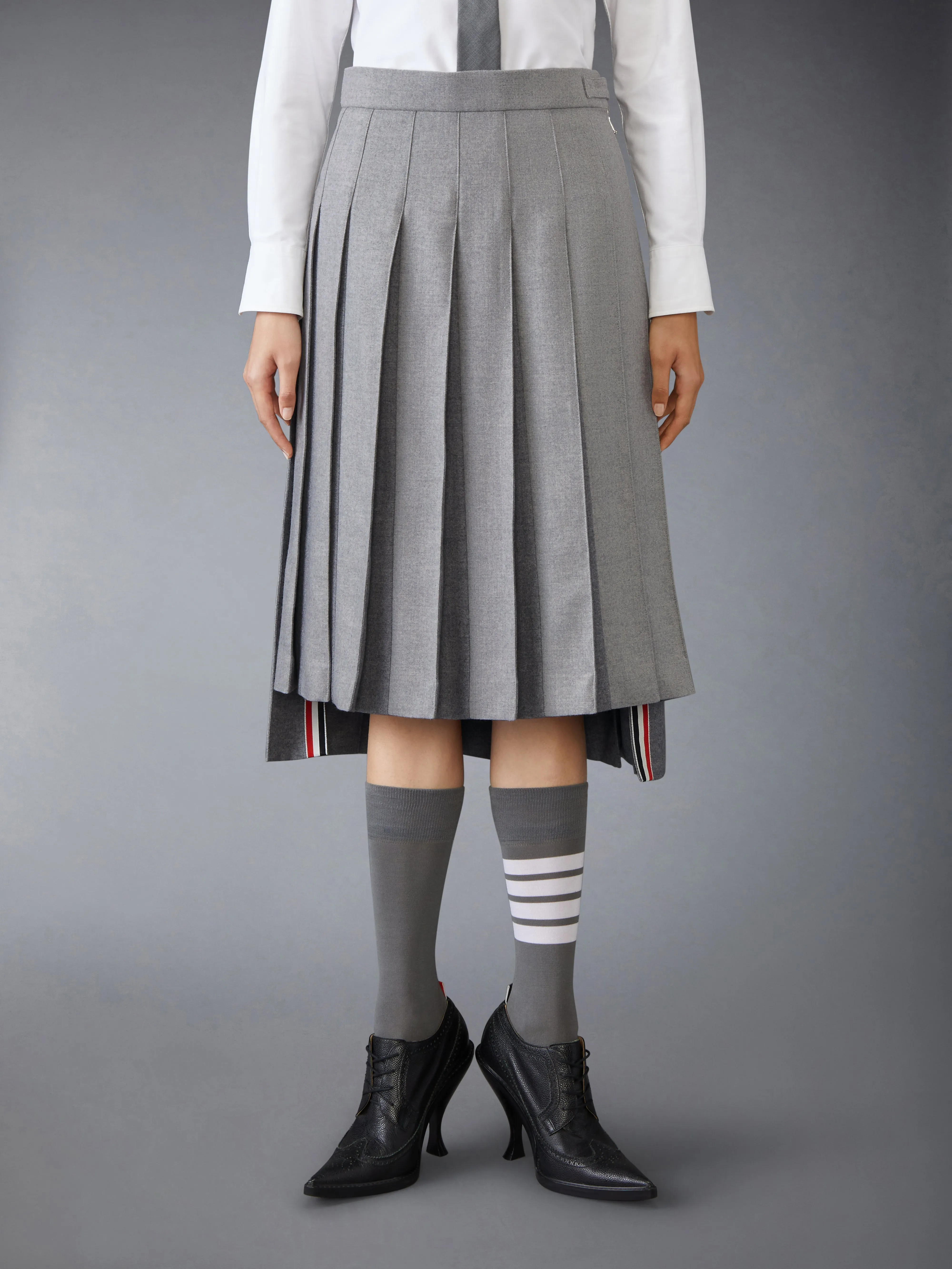 WOOL FLANNEL PLEATED SKIRT sold by Thom Browne
