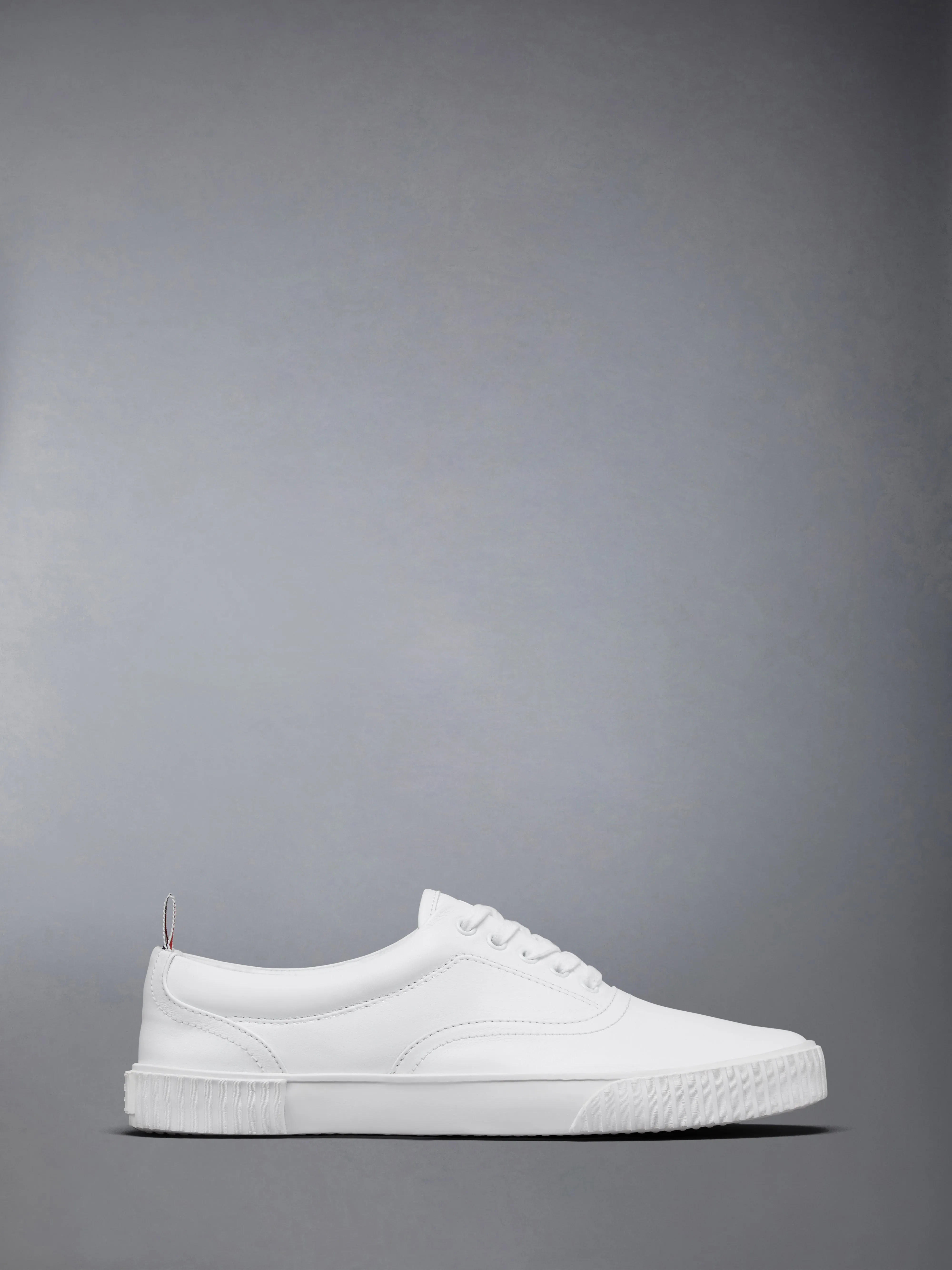 VITELLO CALF LEATHER HERITAGE SNEAKERS sold by Thom Browne