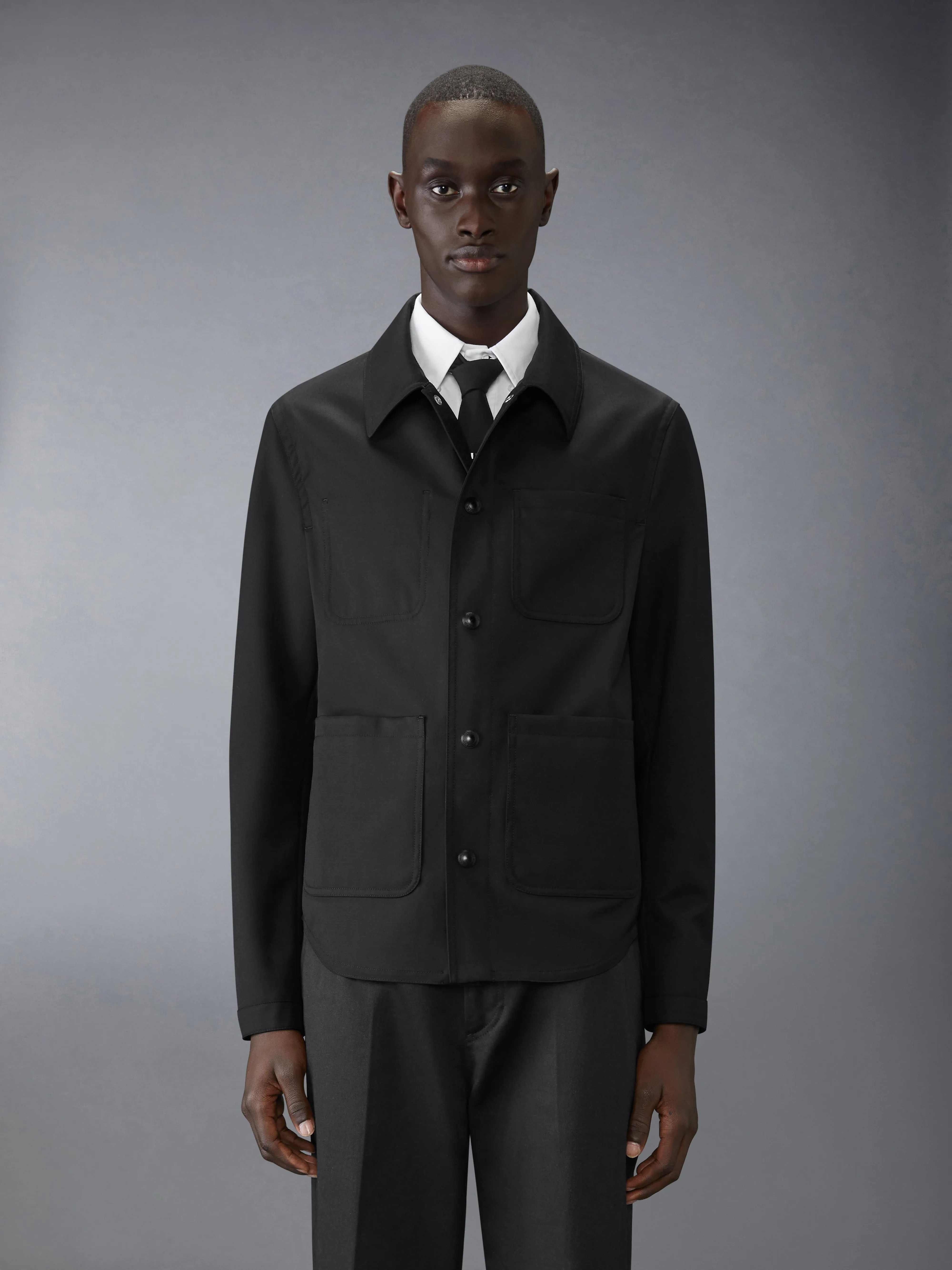 WOOL TWILL UTILITY JACKET sold by Thom Browne