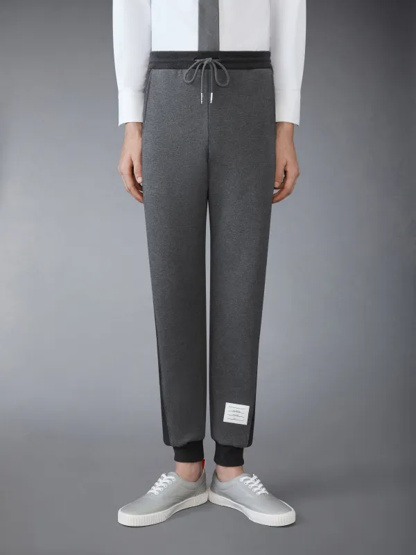CLASSIC 4-BAR JERSEY LOOPBACK SWEATPANTS sold by Thom Browne