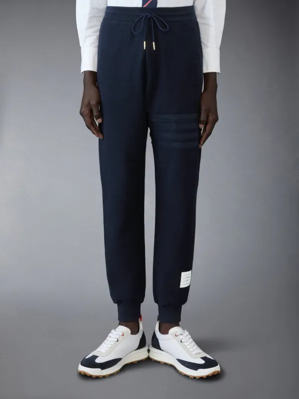 LOOPBACK 4-BAR SWEATPANTS sold by Thom Browne