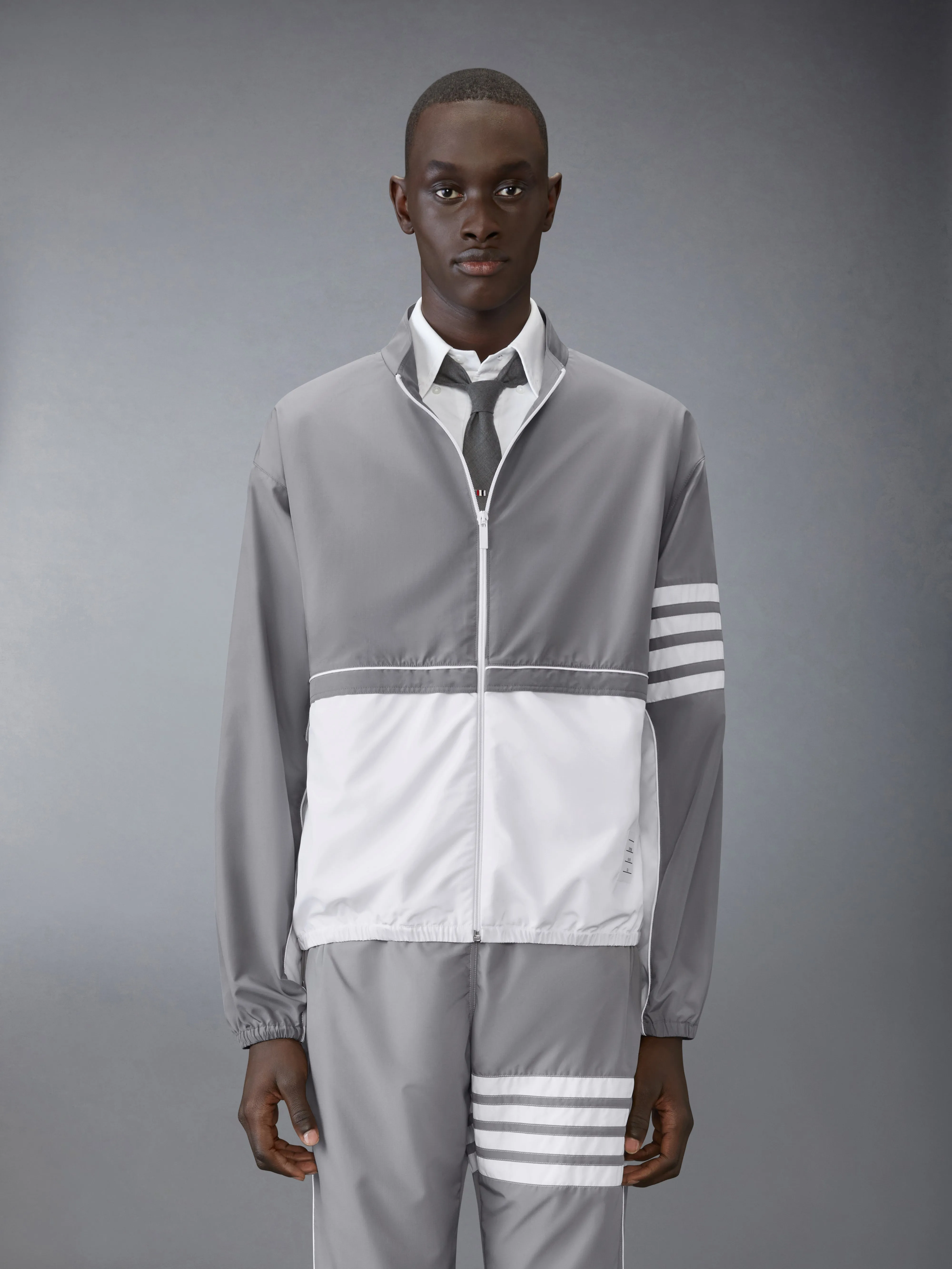 RIPSTOP 4-BAR COLOR BLOCK WINDBREAKER sold by Thom Browne