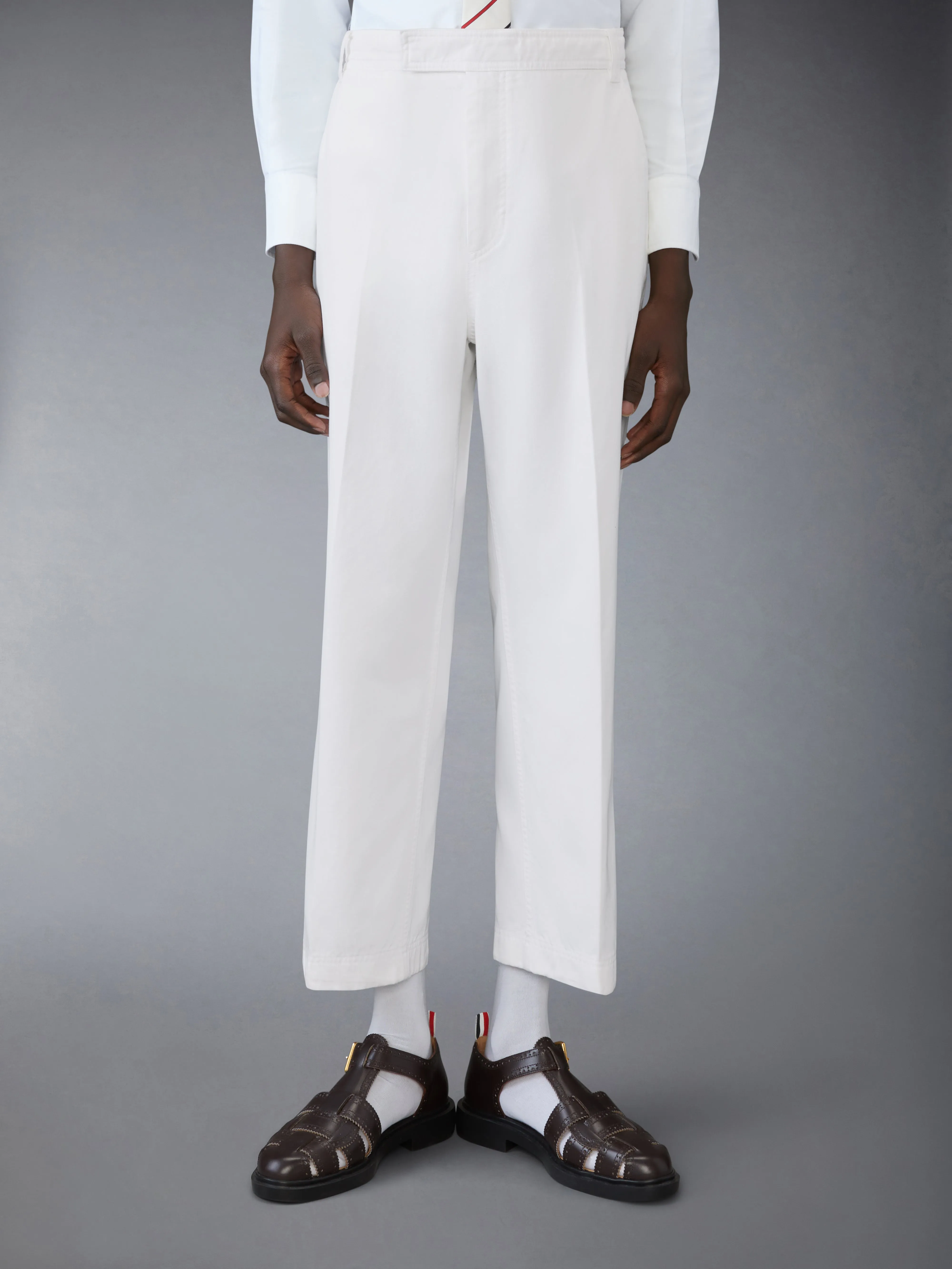 COTTON TWILL UTILITY TROUSERS sold by Thom Browne