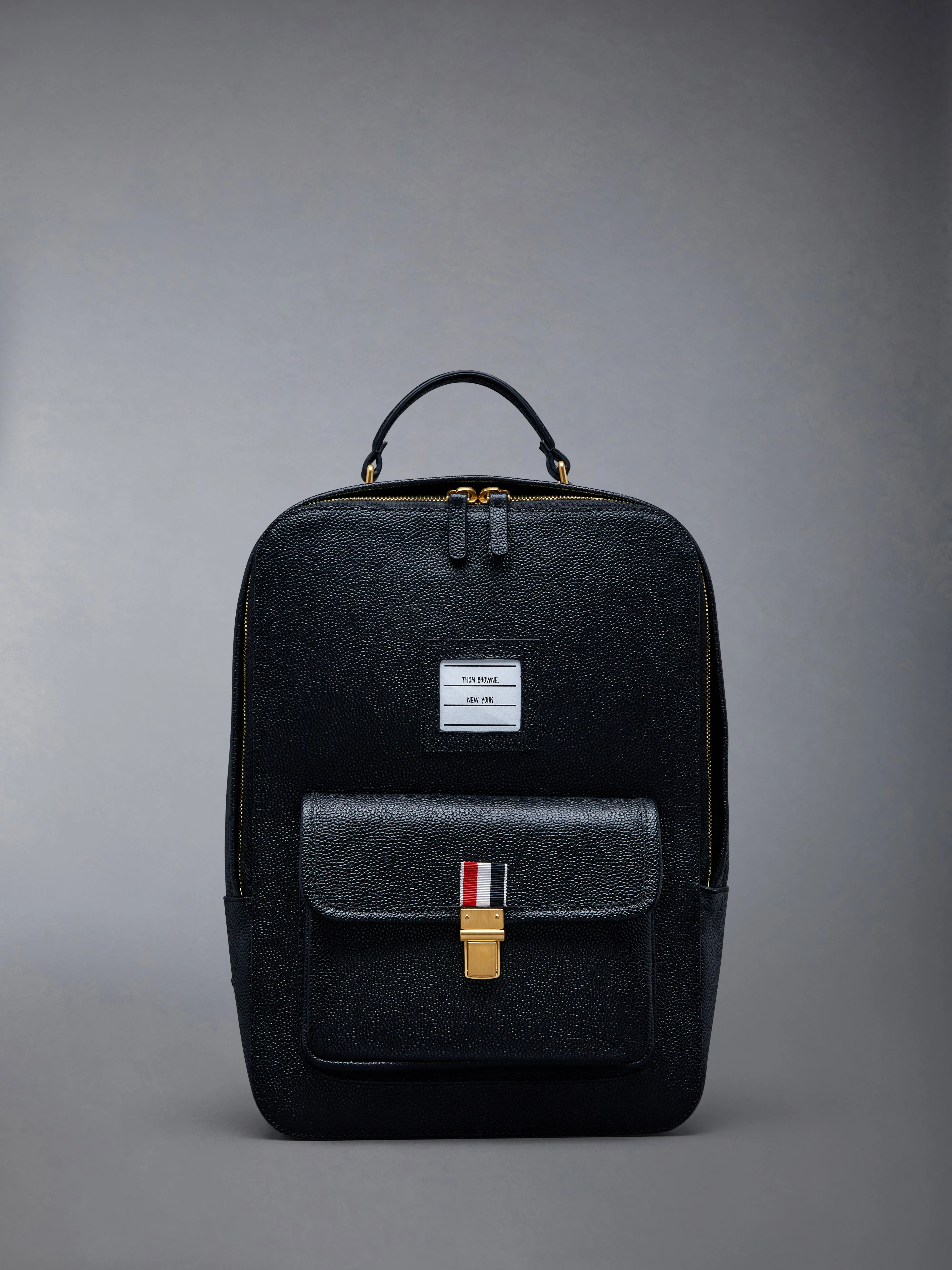 Pebble Grain Leather School Backpack sold by Thom Browne