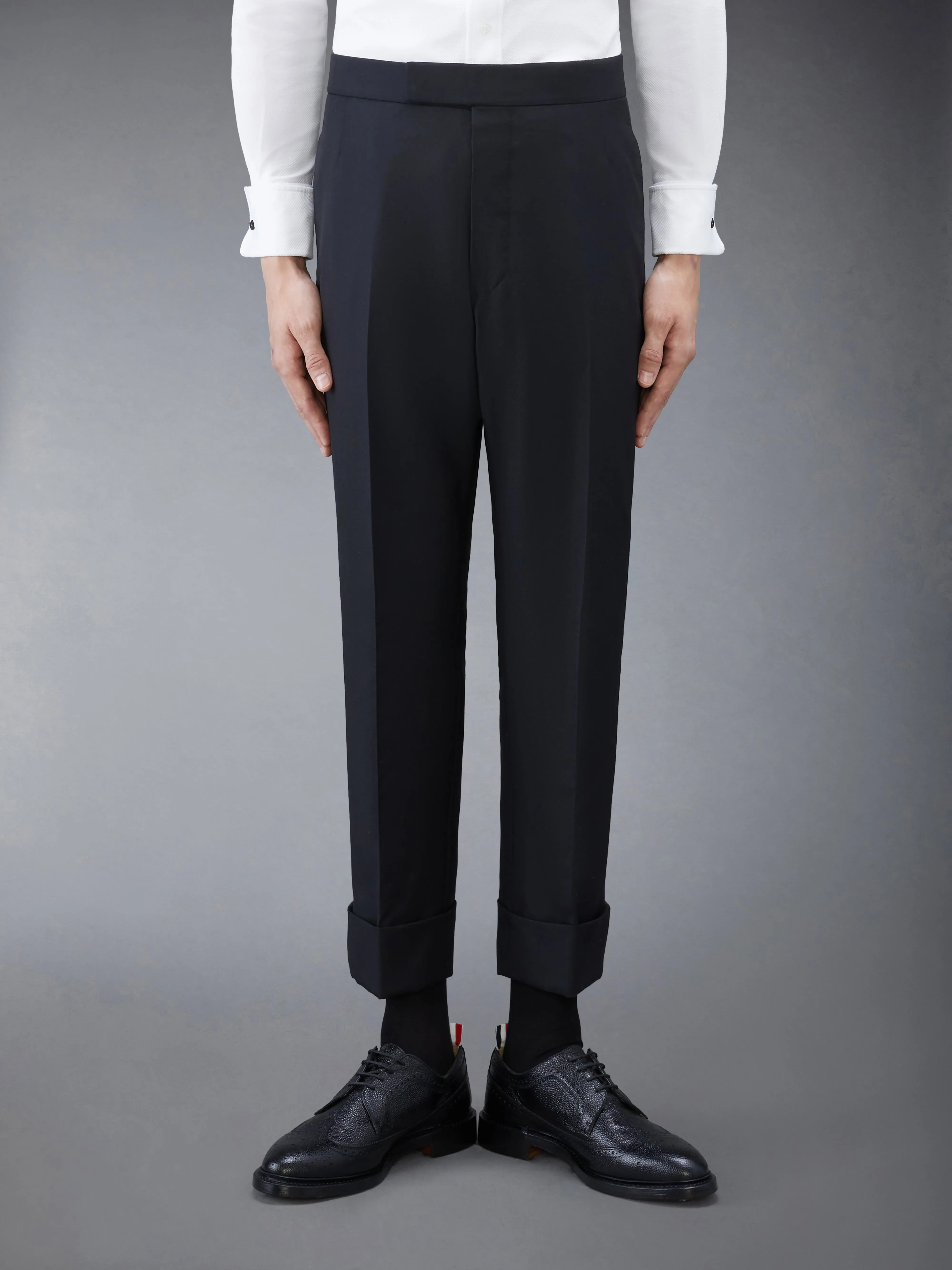 TWILL CLASSIC BACKSTRAP TROUSERS sold by Thom Browne