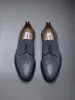 Pebble Grain Leather Longwing Brogue sold by Thom Browne